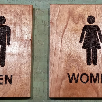 Custom restroom signs wood burned on Cherry